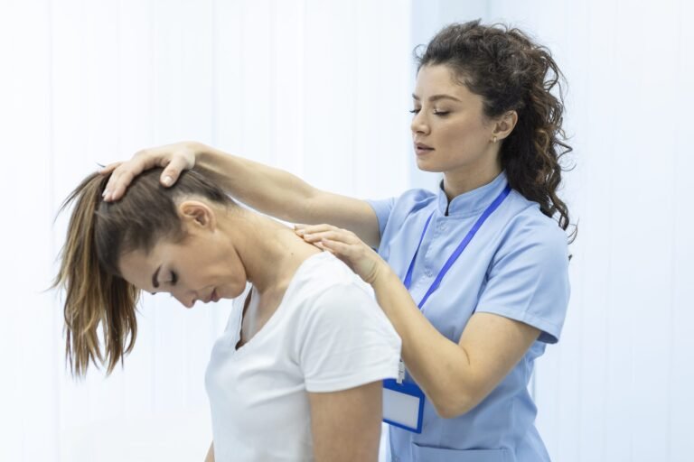 Physiotherapist assessing neck pain