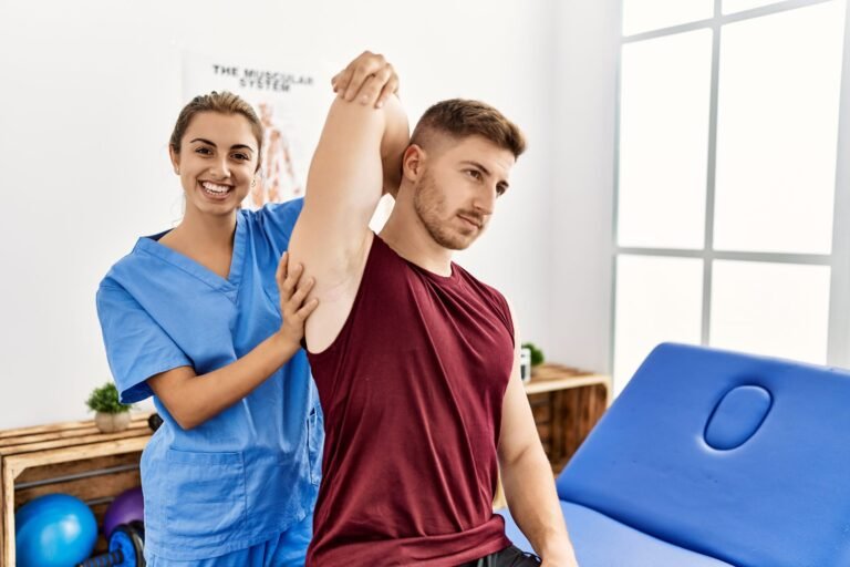 Physiotherapist at WayPhysio Greater Noida guiding a shoulder stretch