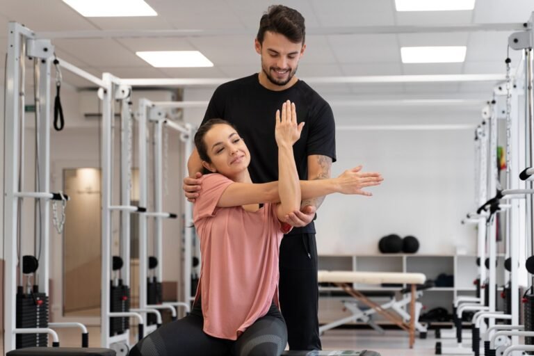 Strength and conditioning shoulder stretch with physiotherapist